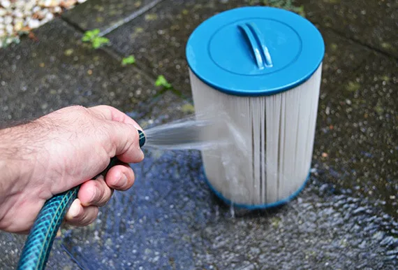 Spa hot tub filters being cleaned
